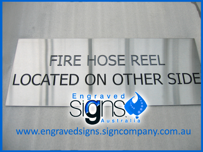 Sign. Fire Hose Reel Located On Other Side Sign