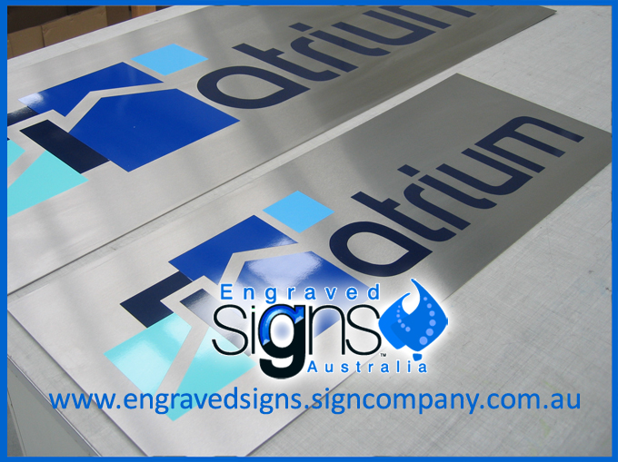 Metal signs with vinyl applied for the colored lettering and sign logo