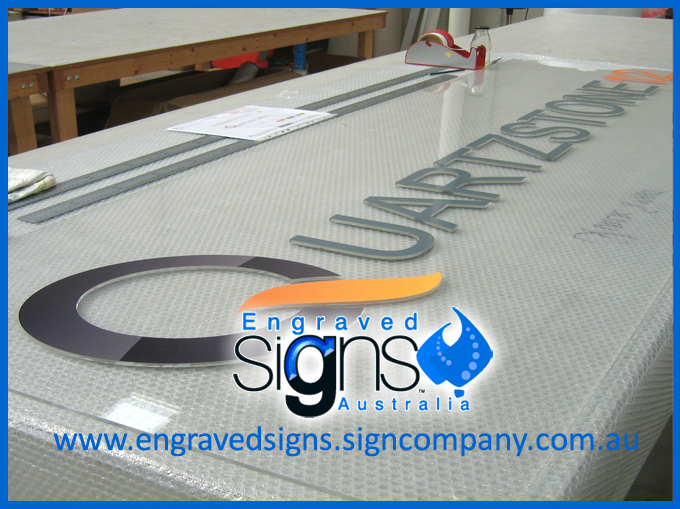 Raised plastic letters on clear sign panel also plastic